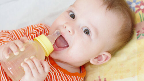 baby with small bottle