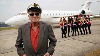 Hugh Hefner Arrives At Stansted Airport For Launch Of Playboy Club London