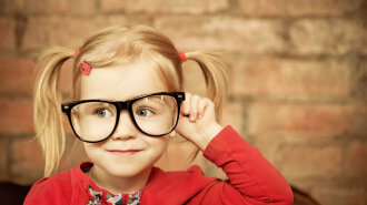 Funny little girl with glasses