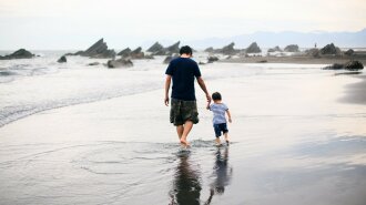People_Father_and_son_are_walking_on_the_water_060338_