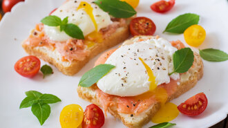 Sandwich with poached eggs with salmon and cream cheese