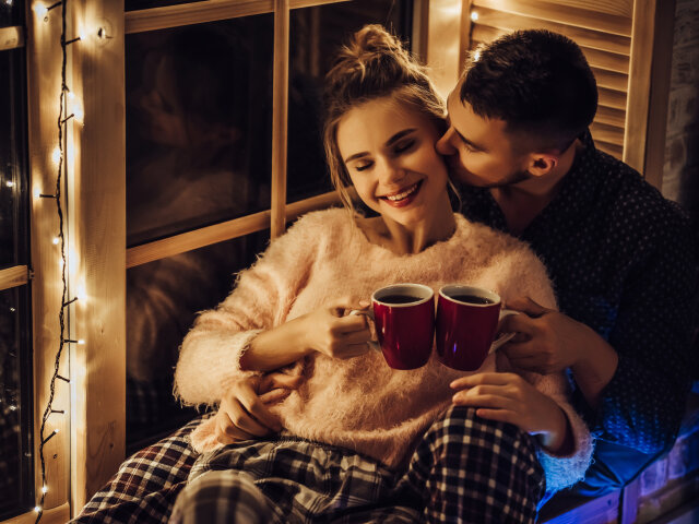 Young romantic couple is having fun in winter outdoors