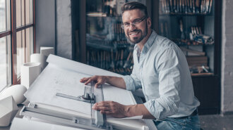 Smiling architect at work