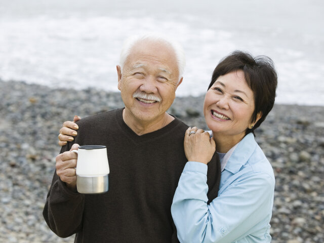 Portrait of a happy and loving mature couple at the beach