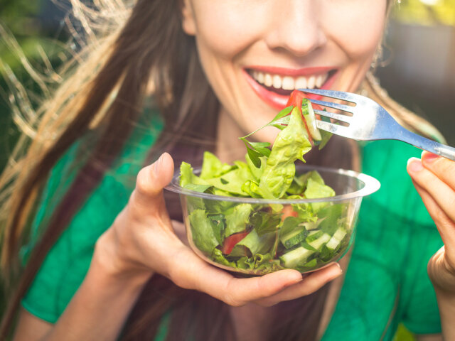 Woman healthy eating salad