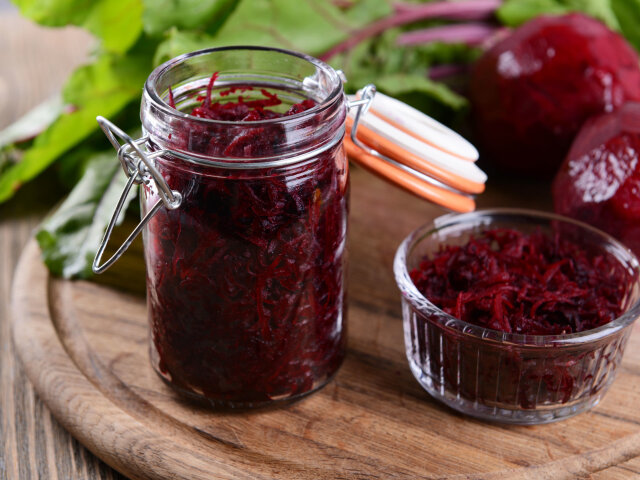 30039106 — grated beetroots in jar on table close-up