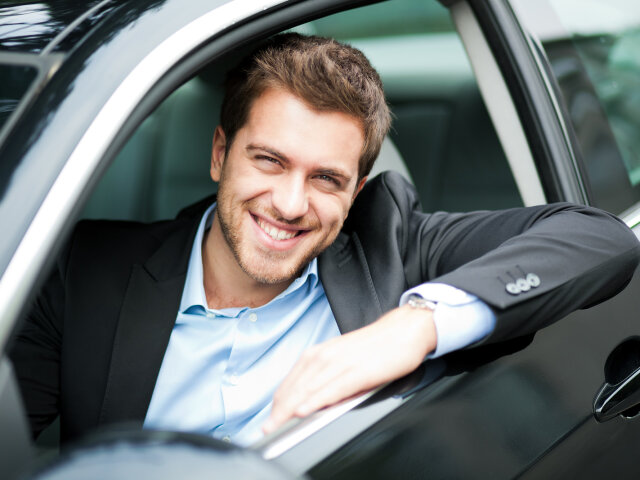 bigstock-Handsome-man-in-his-new-car-38742049