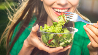 Woman healthy eating salad