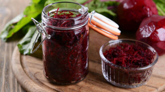 30039106 — grated beetroots in jar on table close-up