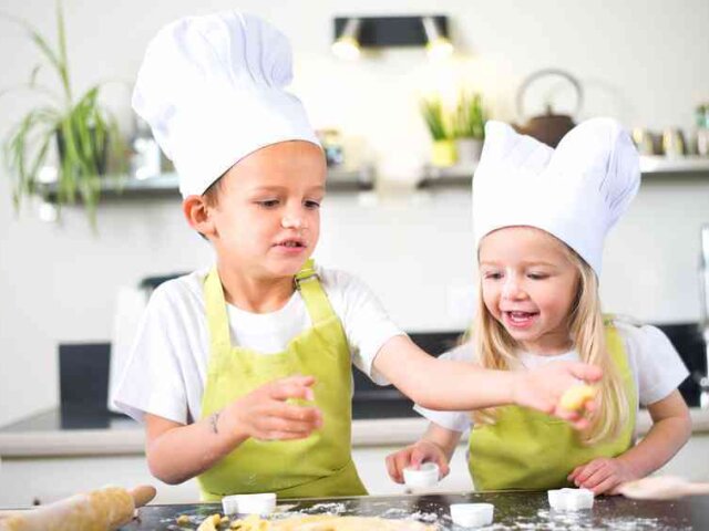 young kids happy childrens family preparing funny cookies in kitchen at home