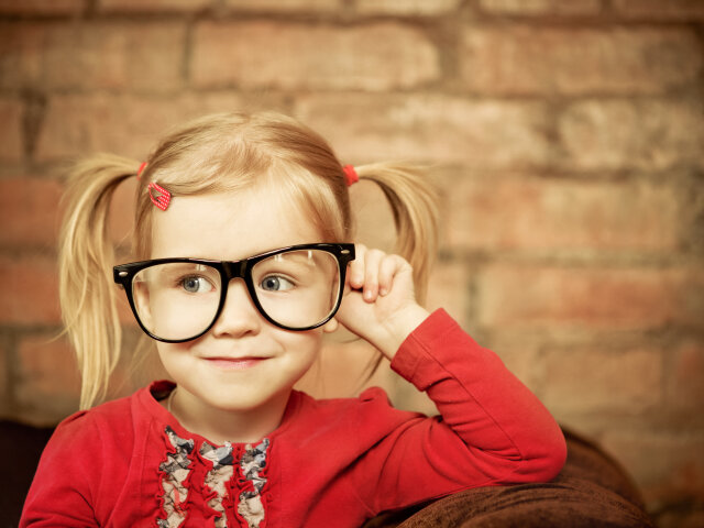 Funny little girl with glasses
