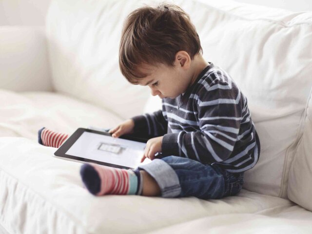 Small boy using a tablet